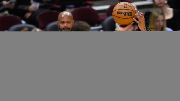 Dec 21, 2023; Cleveland, Ohio, USA; Cleveland Cavaliers forward Emoni Bates (21) shoots as New Orleans Pelicans guard Jordan Hawkins (24) defends in the fourth quarter at Rocket Mortgage FieldHouse.